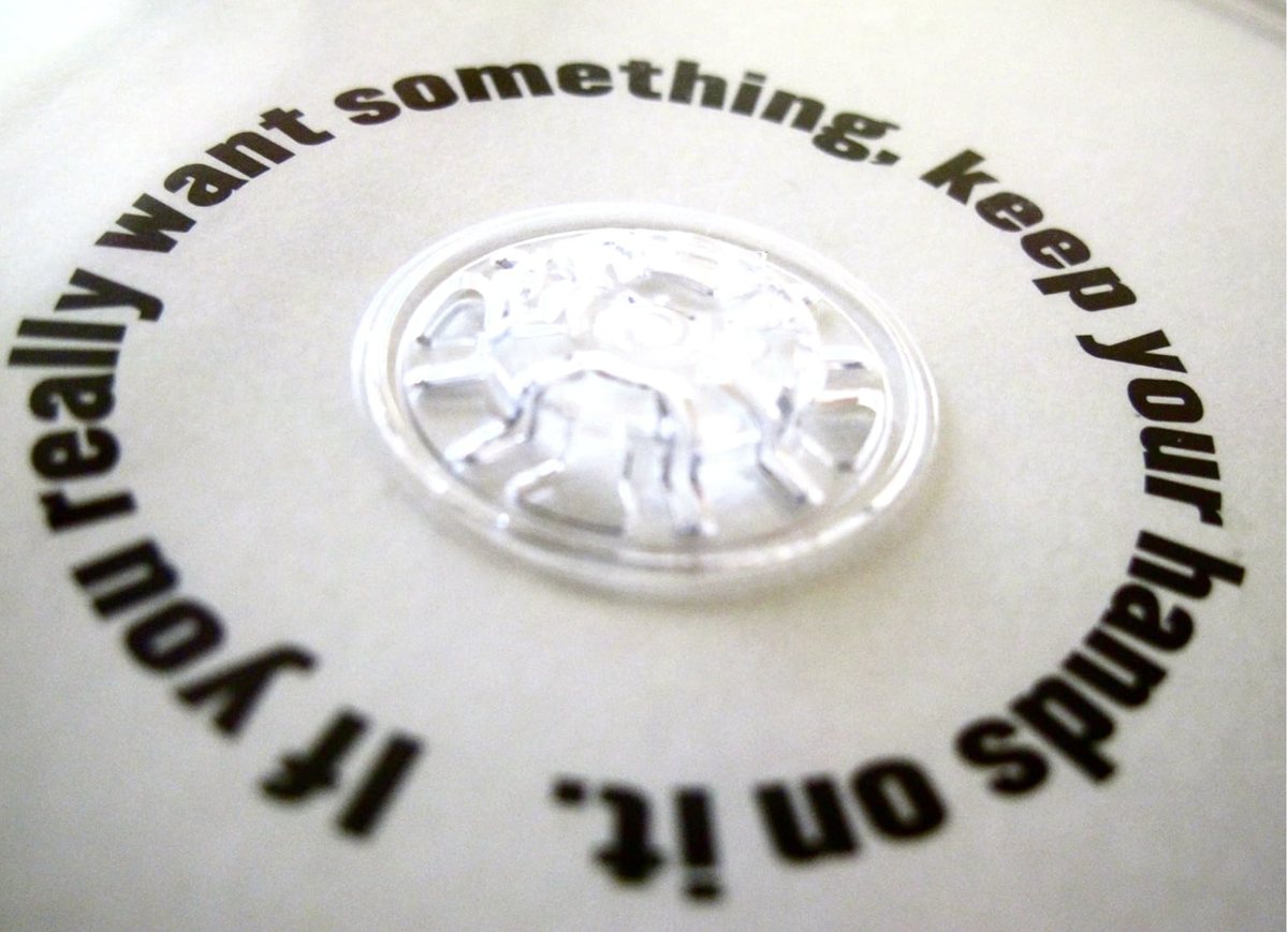The disc tray, printed with If you really want something, keep your hands on it