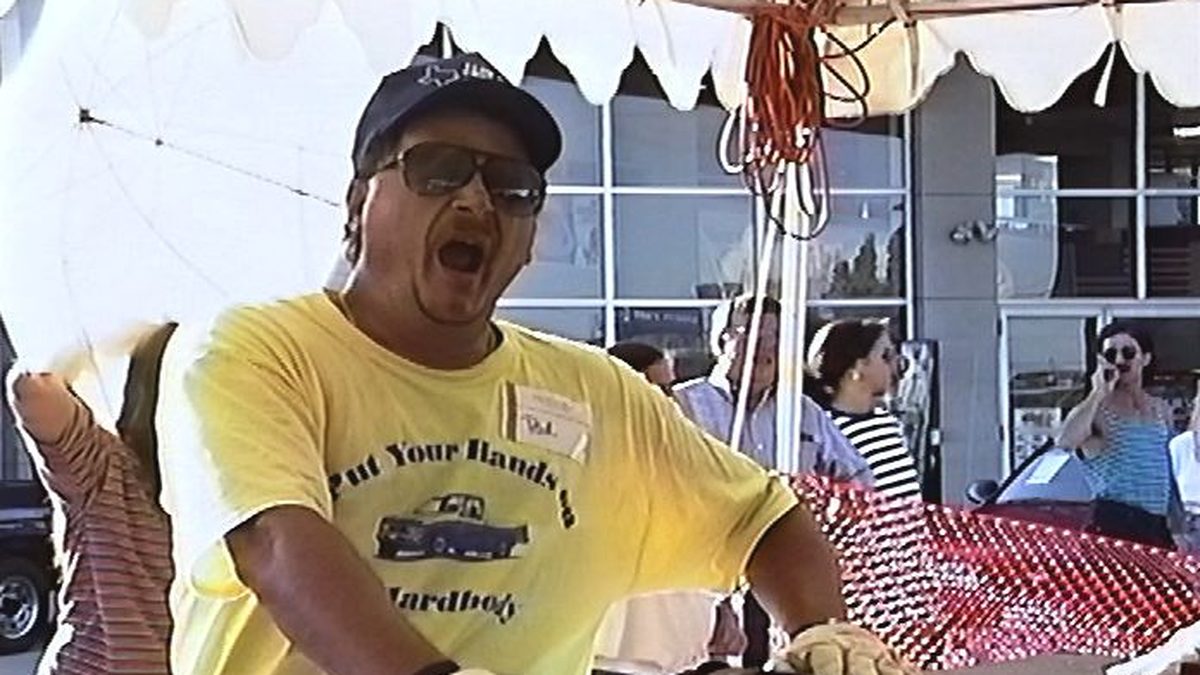A contestant yawning, hand on the truck